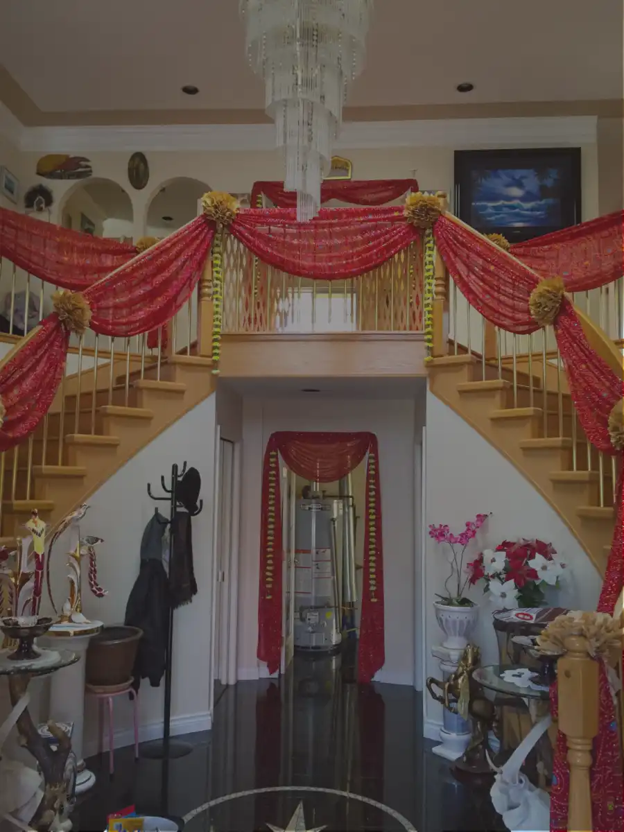 Red and gold bifurcated home staircase décor · Dream Decorators Surrey