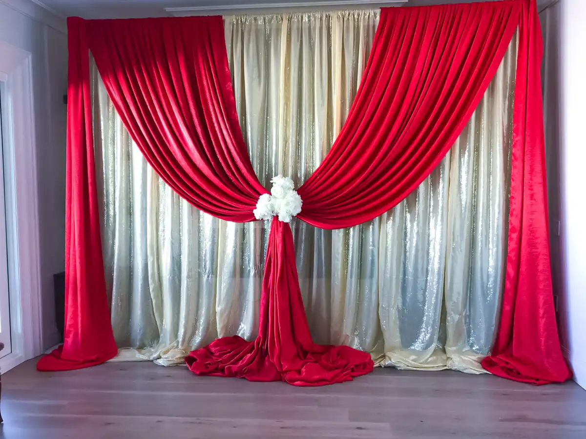Red and gold sequin home event backdrop · Dream Decorators