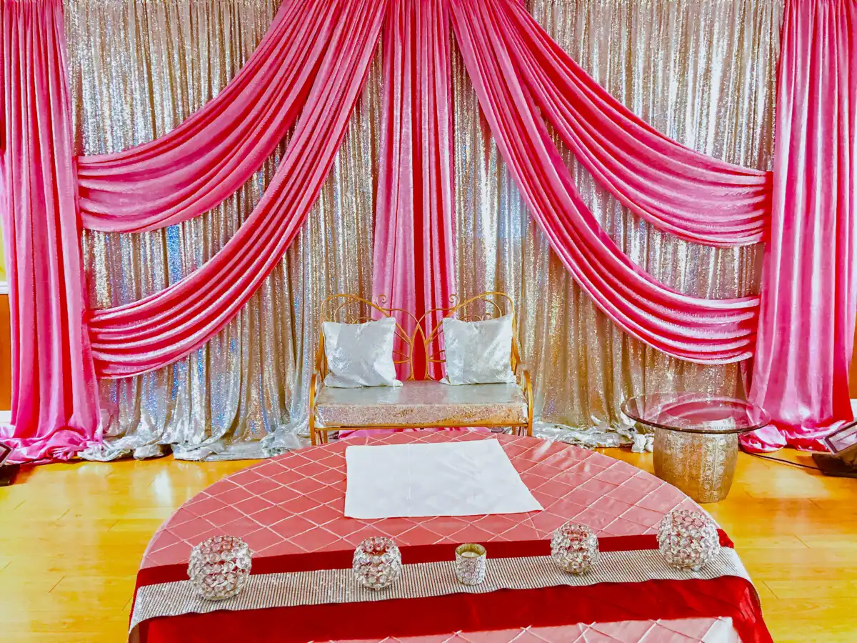 Pink and silver sequin sangeet stage backdrop · Dream Decorators