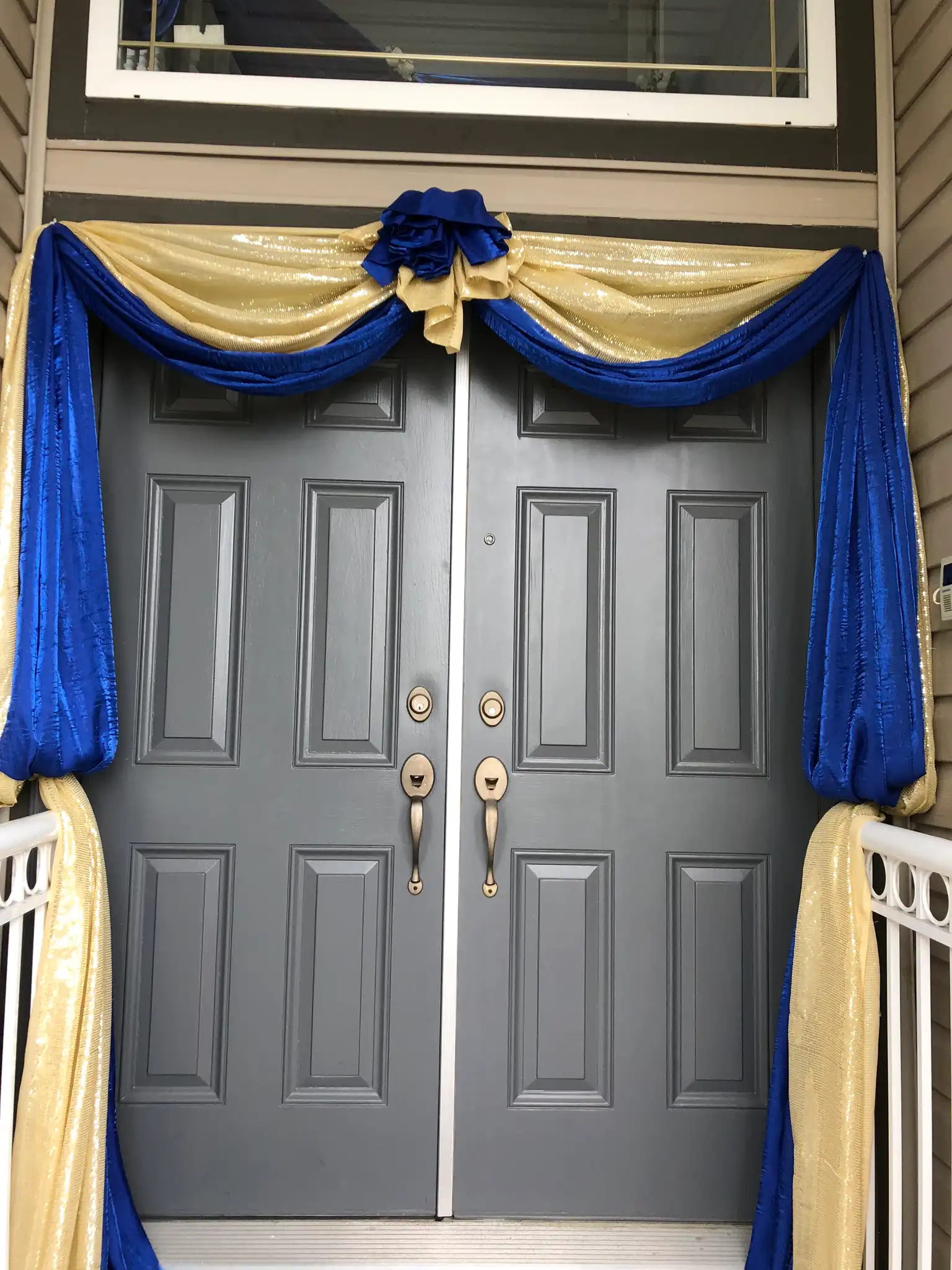 Royal blue and gold home entrance door draping · Dream Decorators