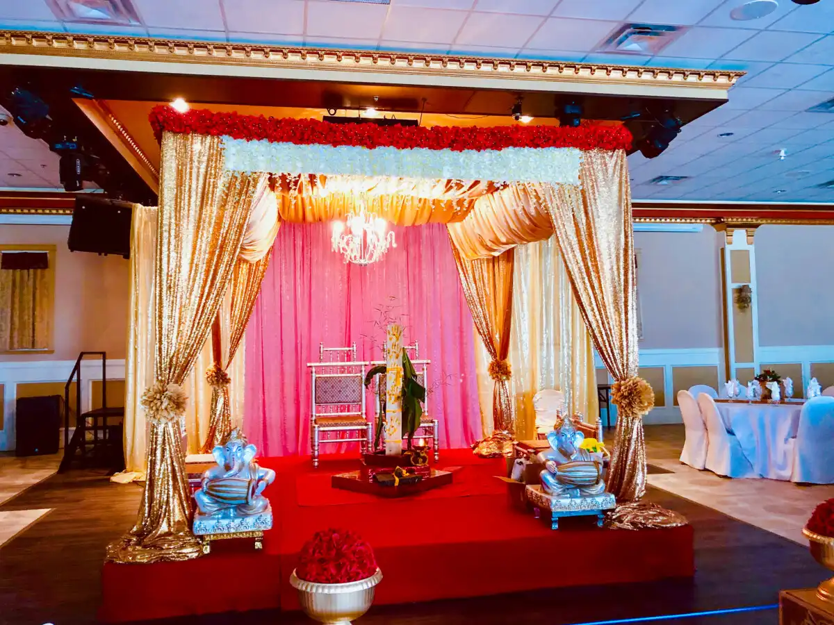 Gold sequin pink mandap with silver Ganesha statues · Surrey wedding décor by Dream Decorators