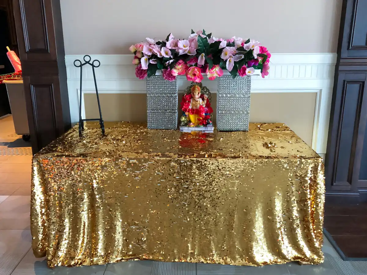 Gold sequin Ganesha welcome table · Dream Decorators Surrey