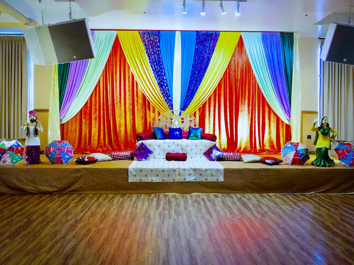 Punjabi folk sangeet sunburst stage décor · Dream Decorators