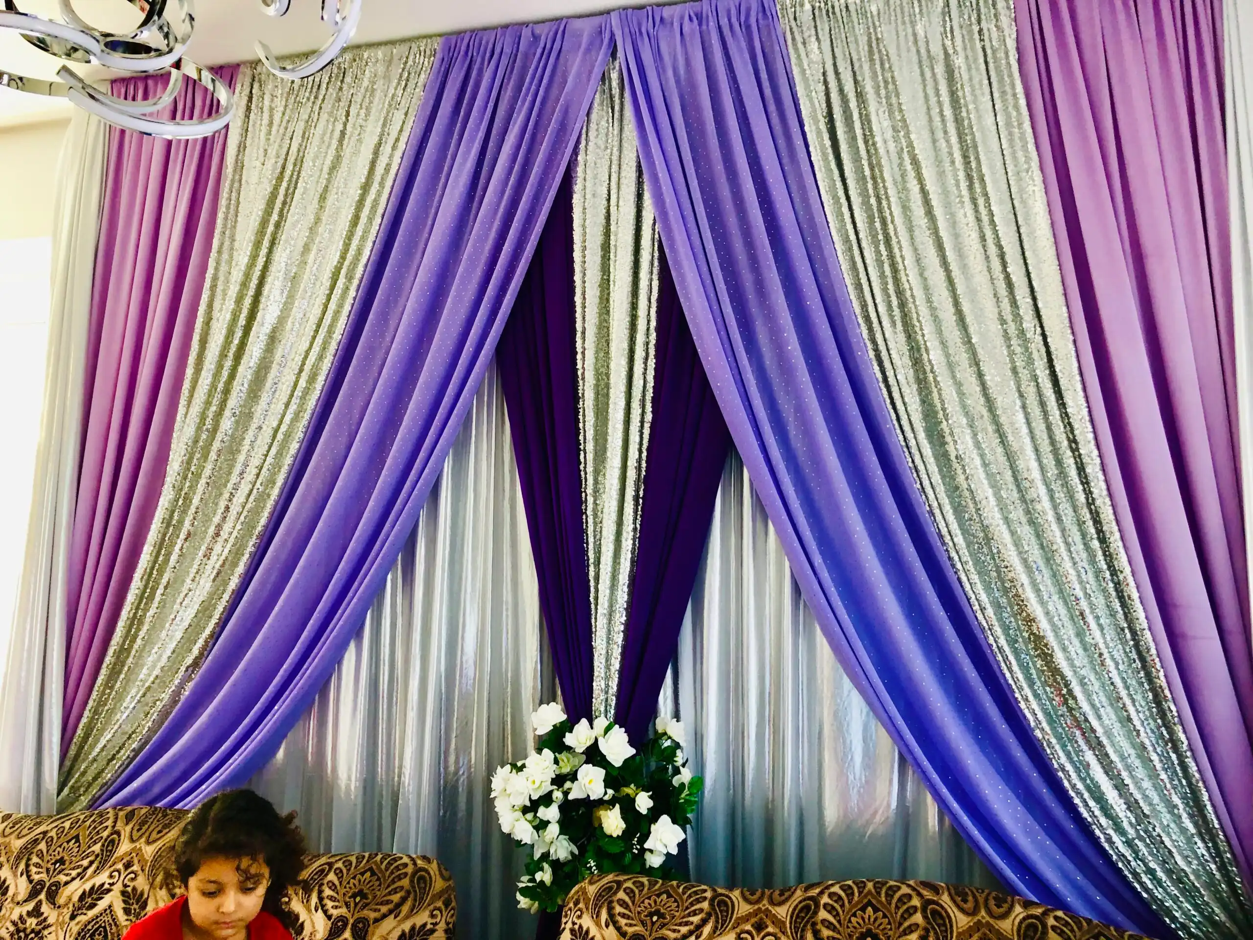 Purple and silver home event draped backdrop · Dream Decorators