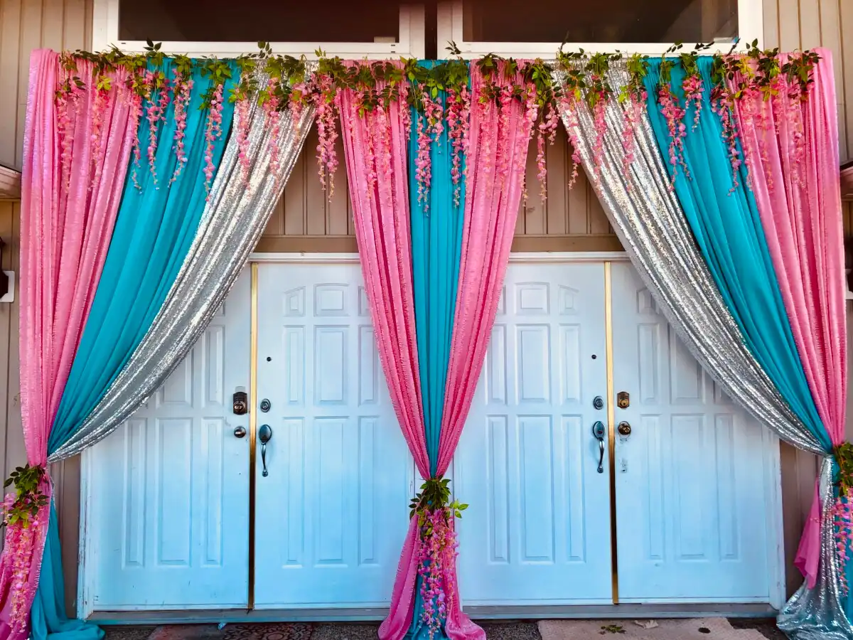 Pink and turquoise home entrance with wisteria fringe · Dream Decorators