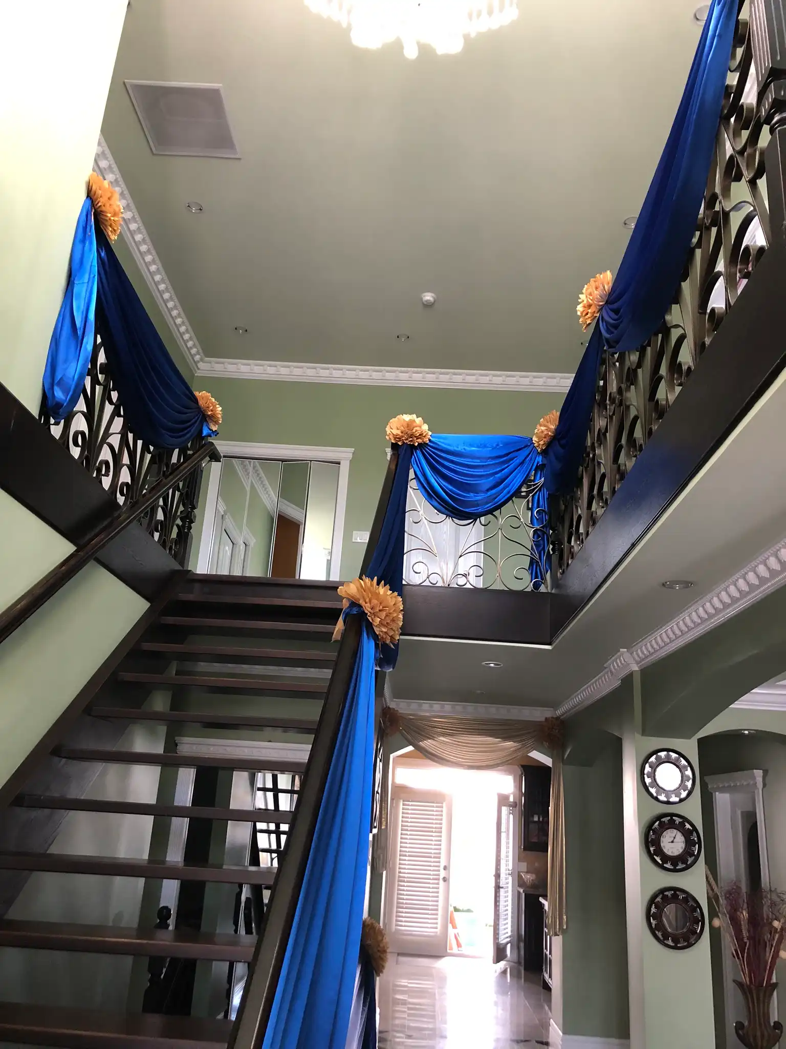Royal blue and gold home staircase draping · Dream Decorators