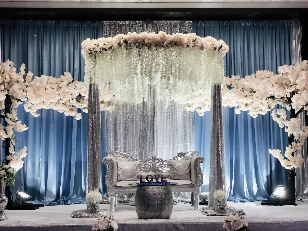 Silver and blue stage with cherry blossom canopy · Dream Decorators