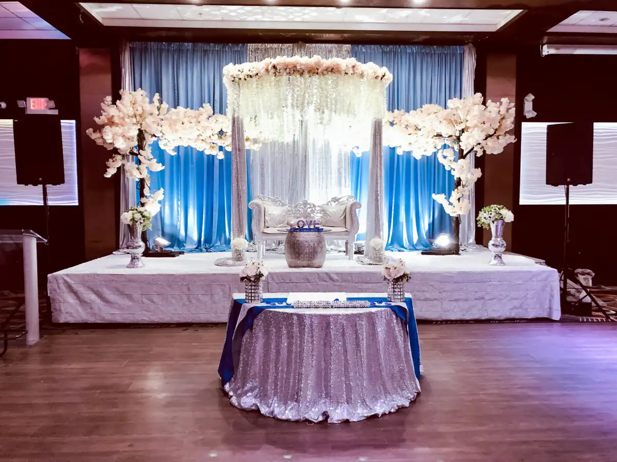 Blue and silver stage with cherry blossom trees · Dream Decorators