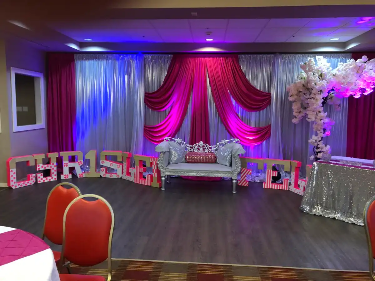 Pink and silver sangeet stage with personalized name letters · Dream Decorators