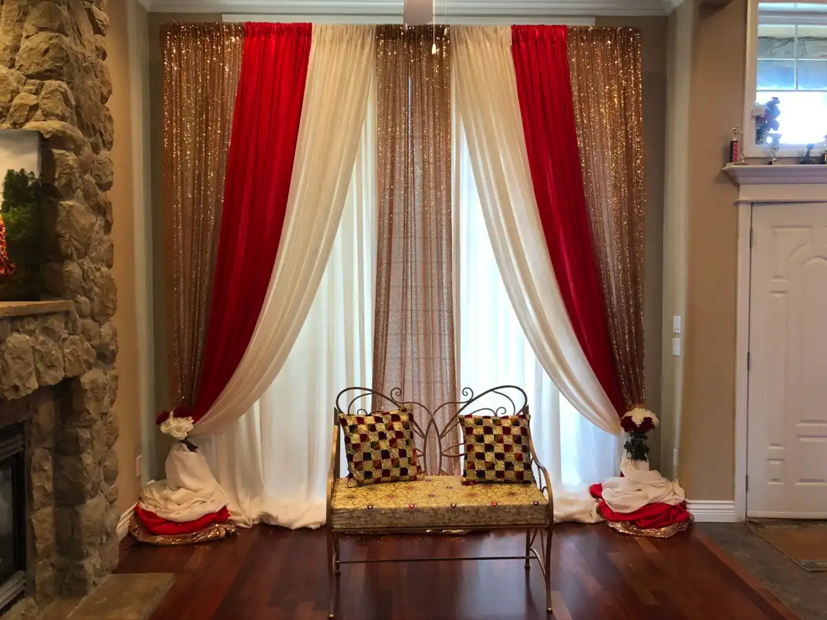 Gold red and cream home backdrop with gold bench · Dream Decorators