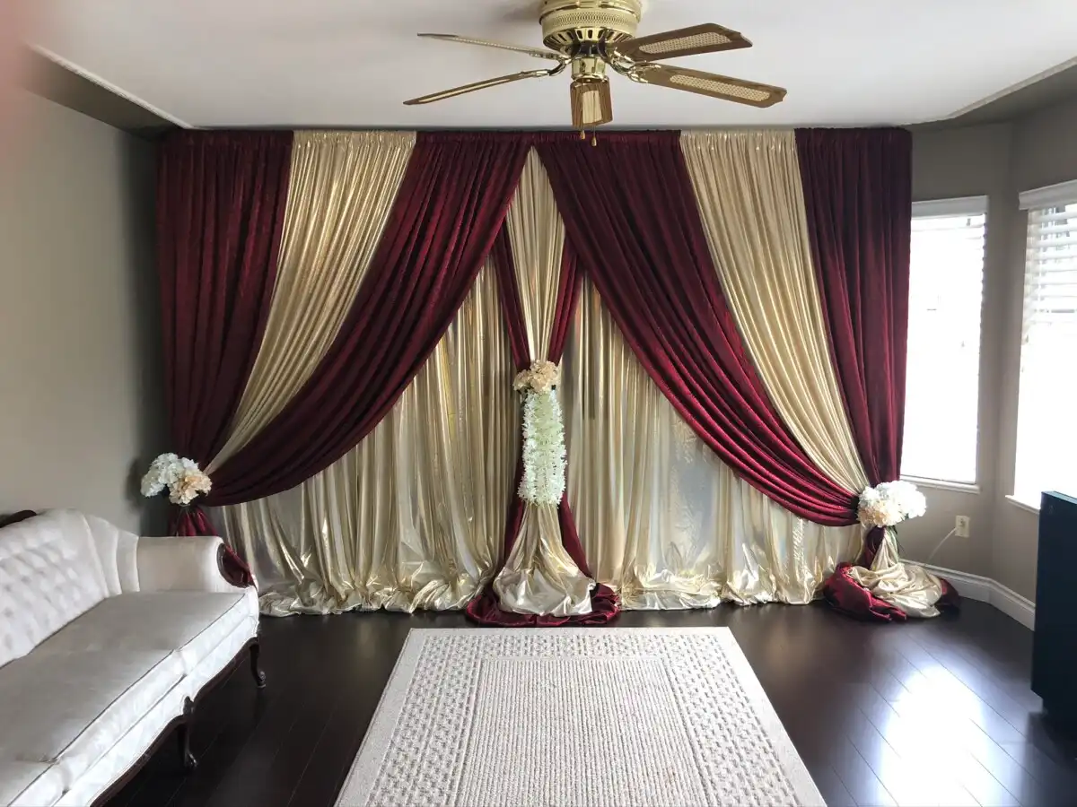 Burgundy and gold home living room backdrop · Dream Decorators