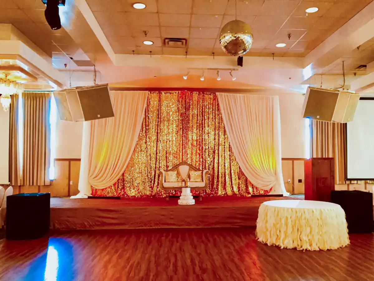Gold sequin and cream draped stage · Dream Decorators