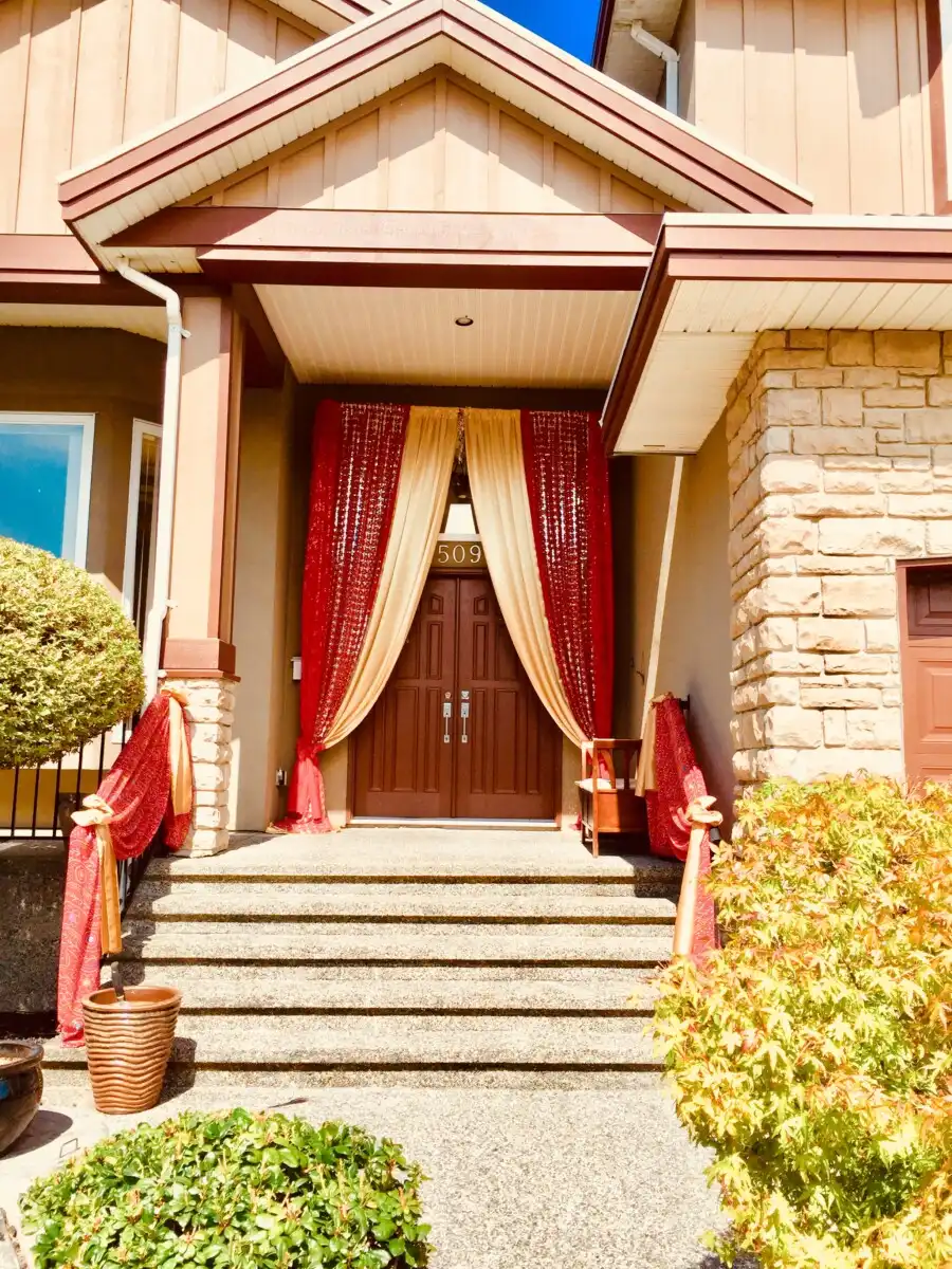 Red and gold home entrance drapes · Dream Decorators Surrey