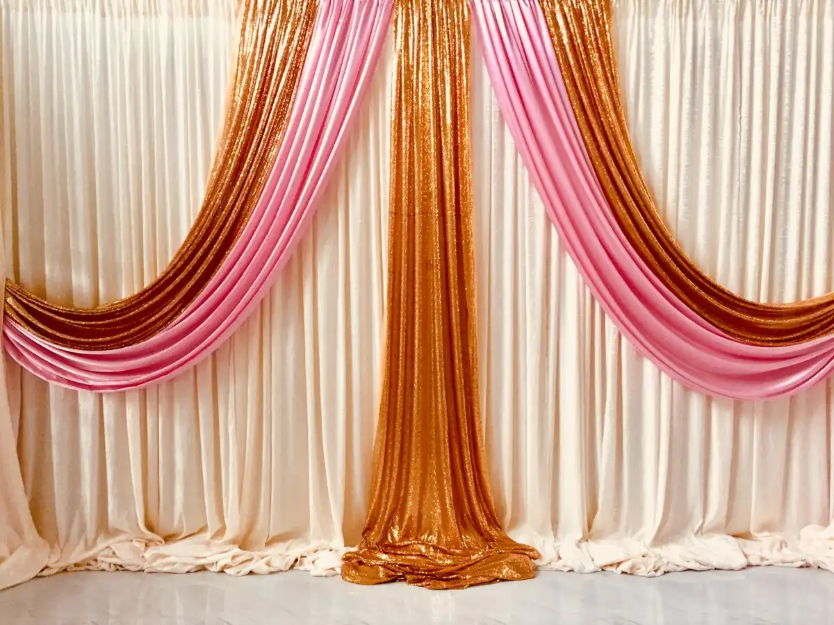 Gold and pink sequin fabric backdrop · Dream Decorators
