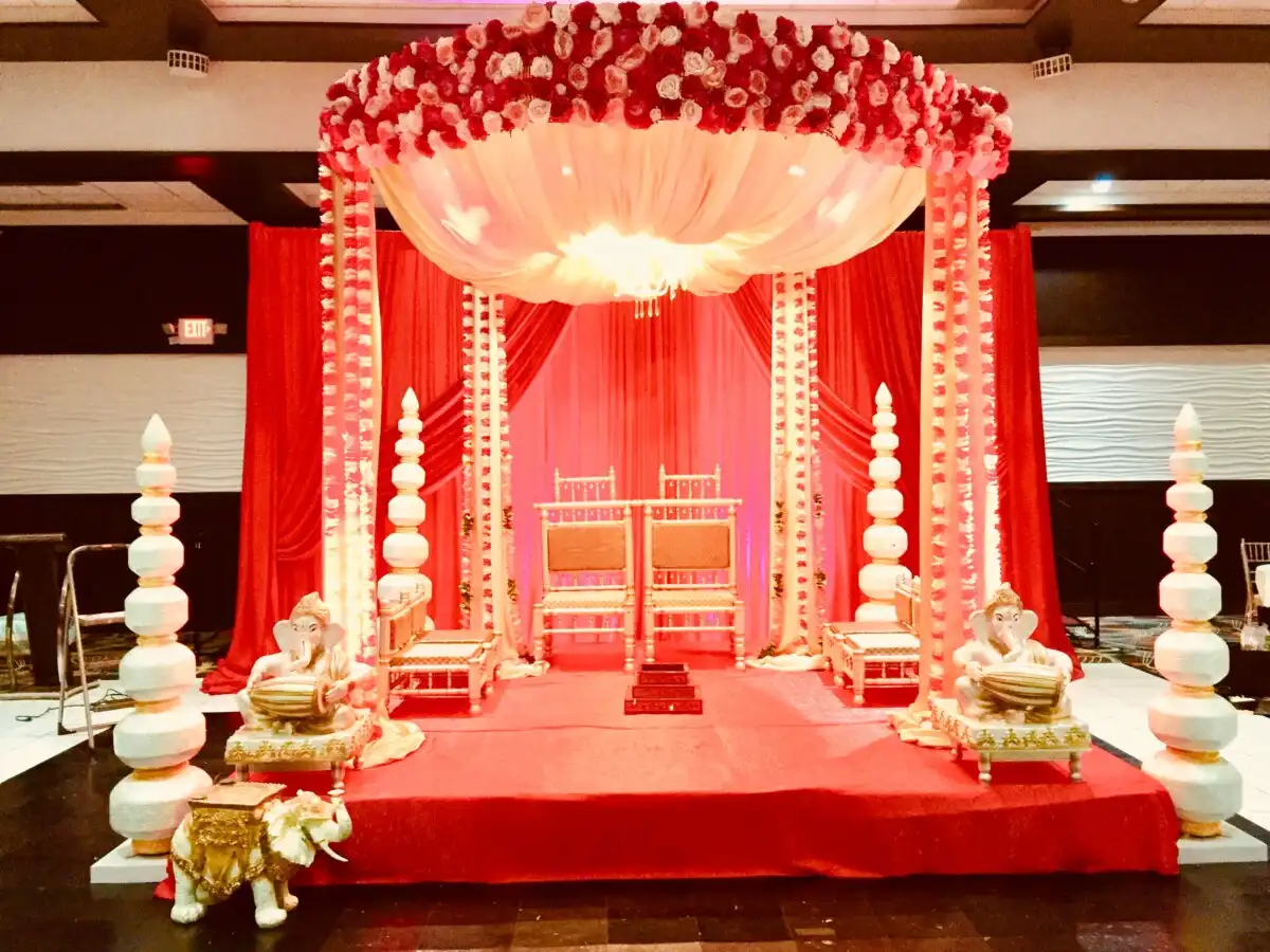 Red and white rose floral mandap · Dream Decorators