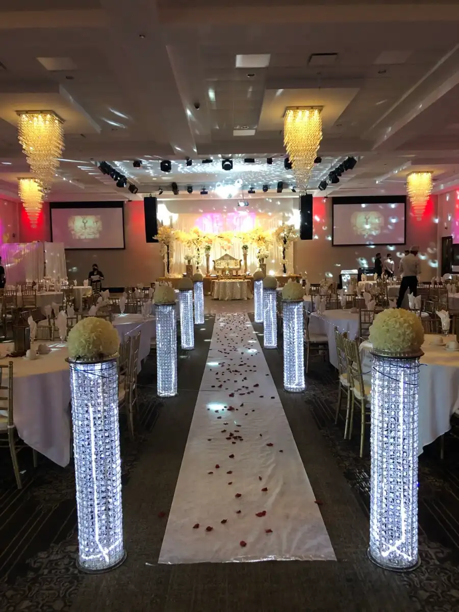 White and gold aisle with illuminated crystal pillars · Dream Decorators Surrey