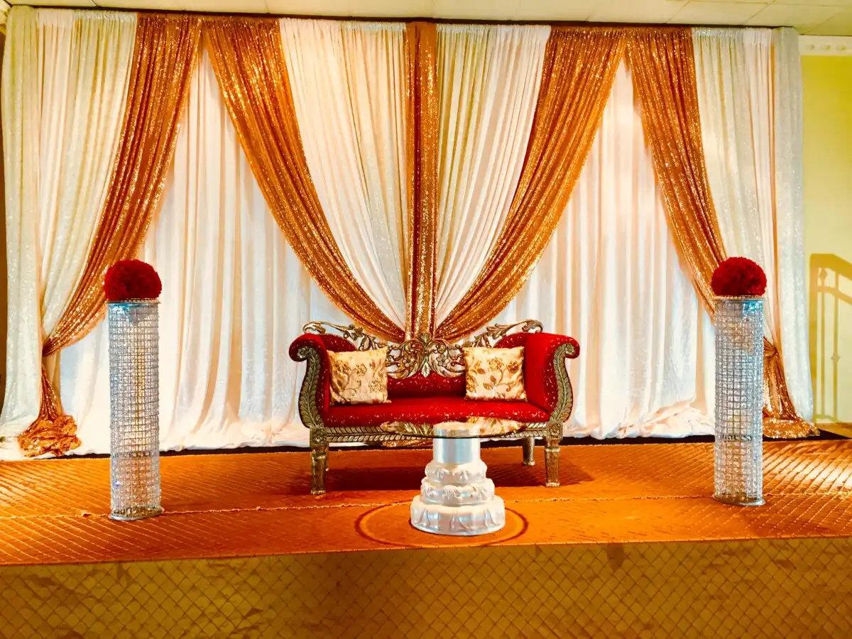 Red and gold throne with sequin backdrop · Dream Decorators