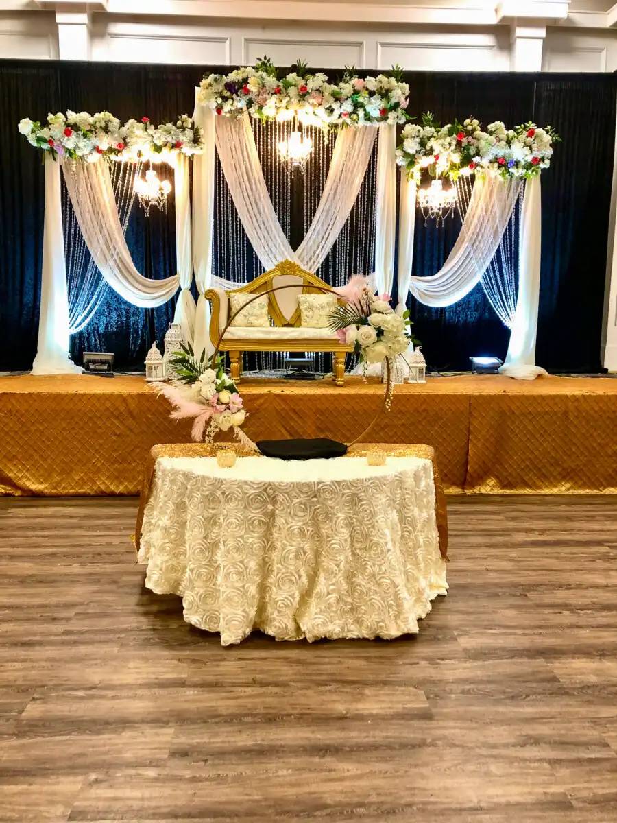 Gold and white stage with crystal chandeliers · Dream Decorators