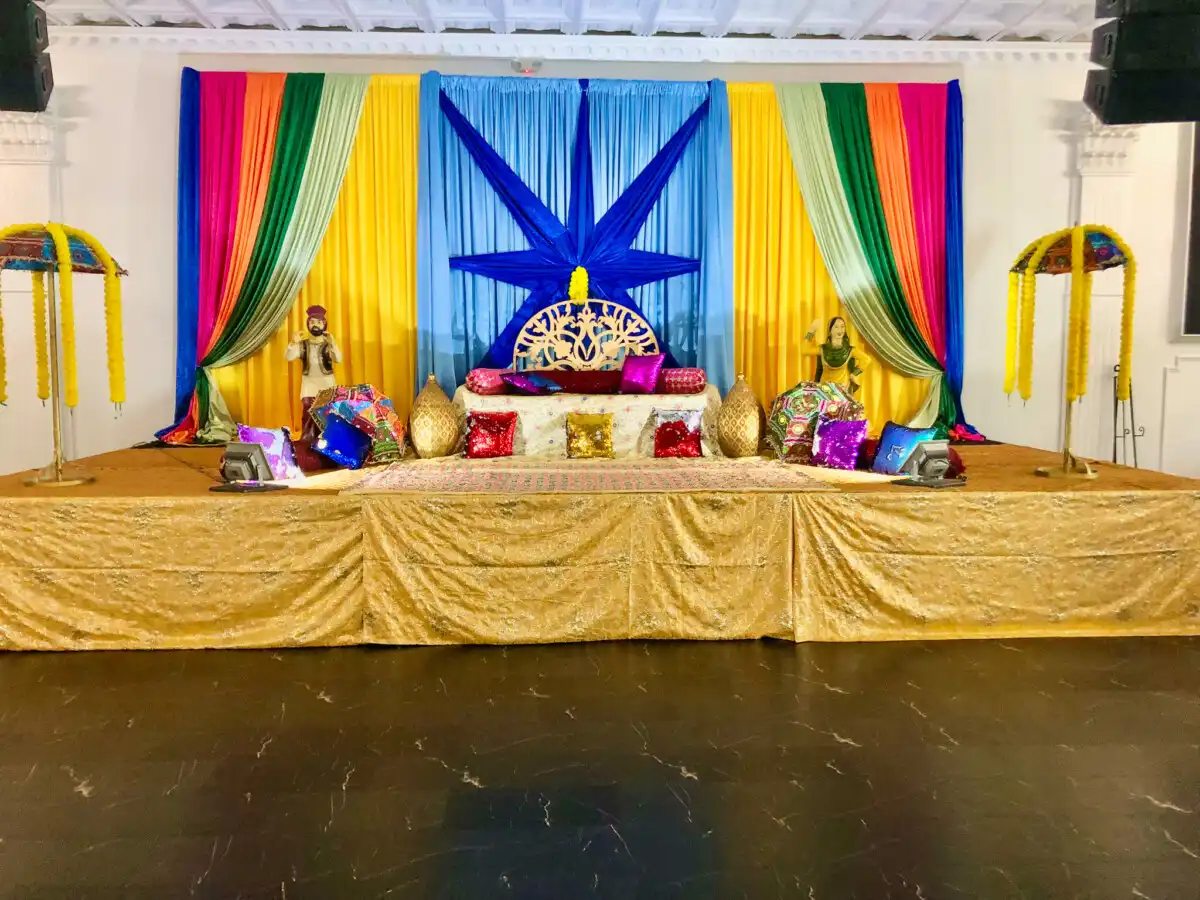 Colorful Punjabi folk mehndi stage · Dream Decorators