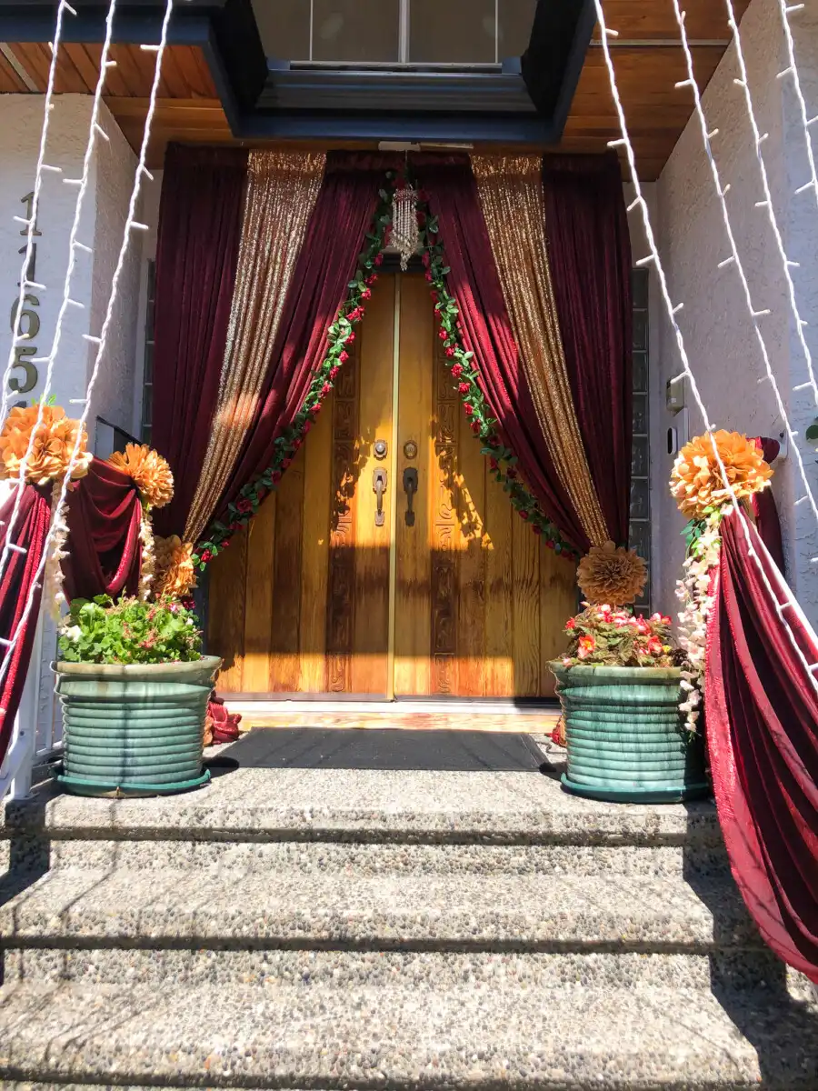 Maroon and gold home entrance décor · Dream Decorators Surrey
