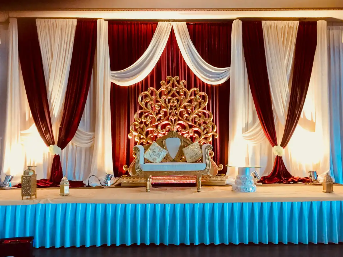 Burgundy and gold throne stage · Dream Decorators