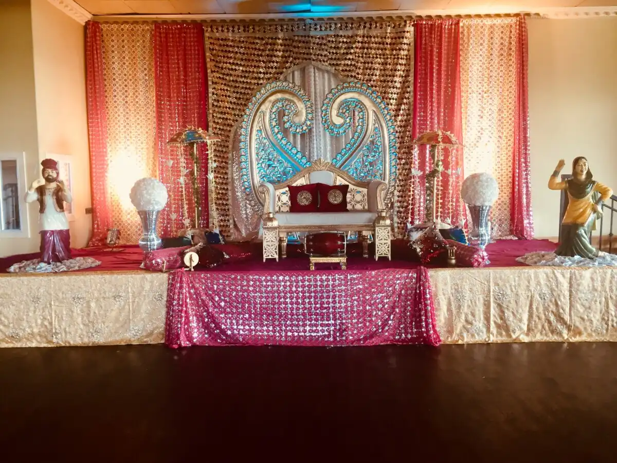 Punjabi sangeet stage with folk statues · Dream Decorators